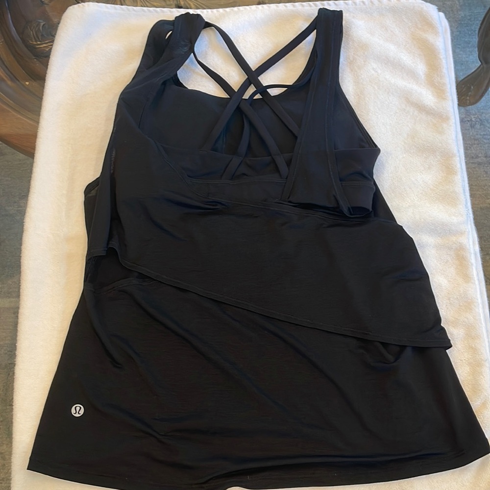 Lululemon size 6 tank top. Black color and built in sports bra.